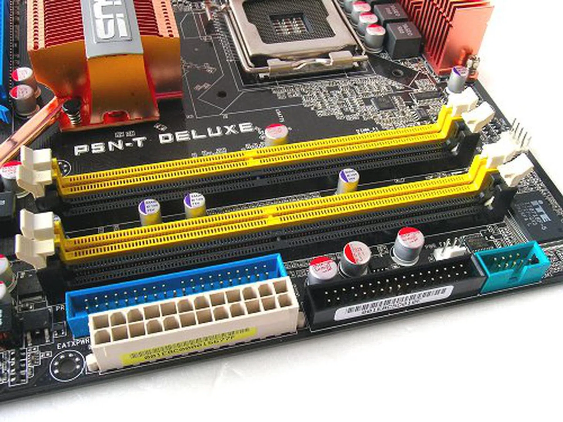 Busy array of connectors. Weidly enough, ASUS put the COM1 port header here as well.
