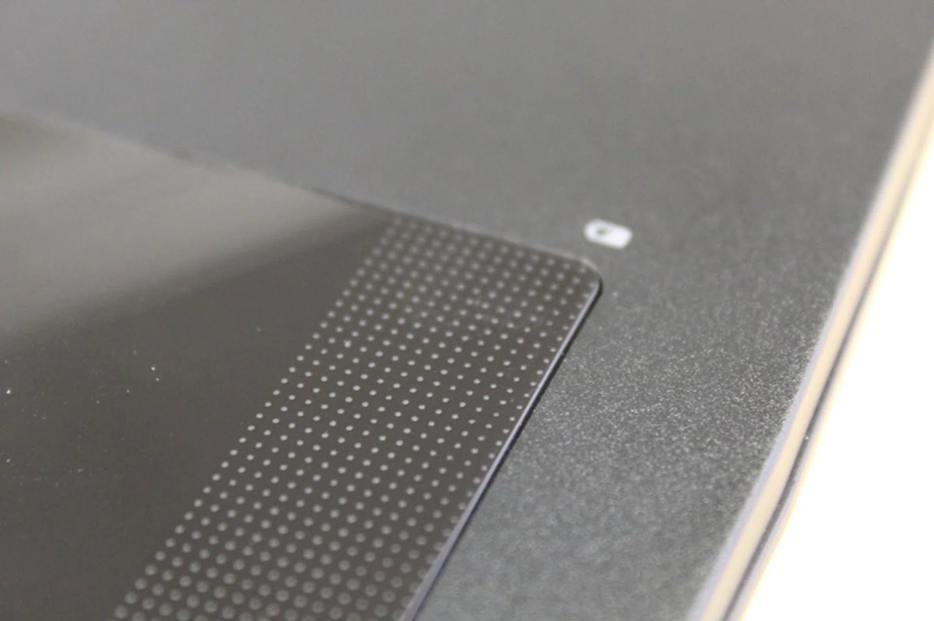 The texture on the trackpad is actually made up of tiny dimples so that you can easily tell when you run your finger over them.