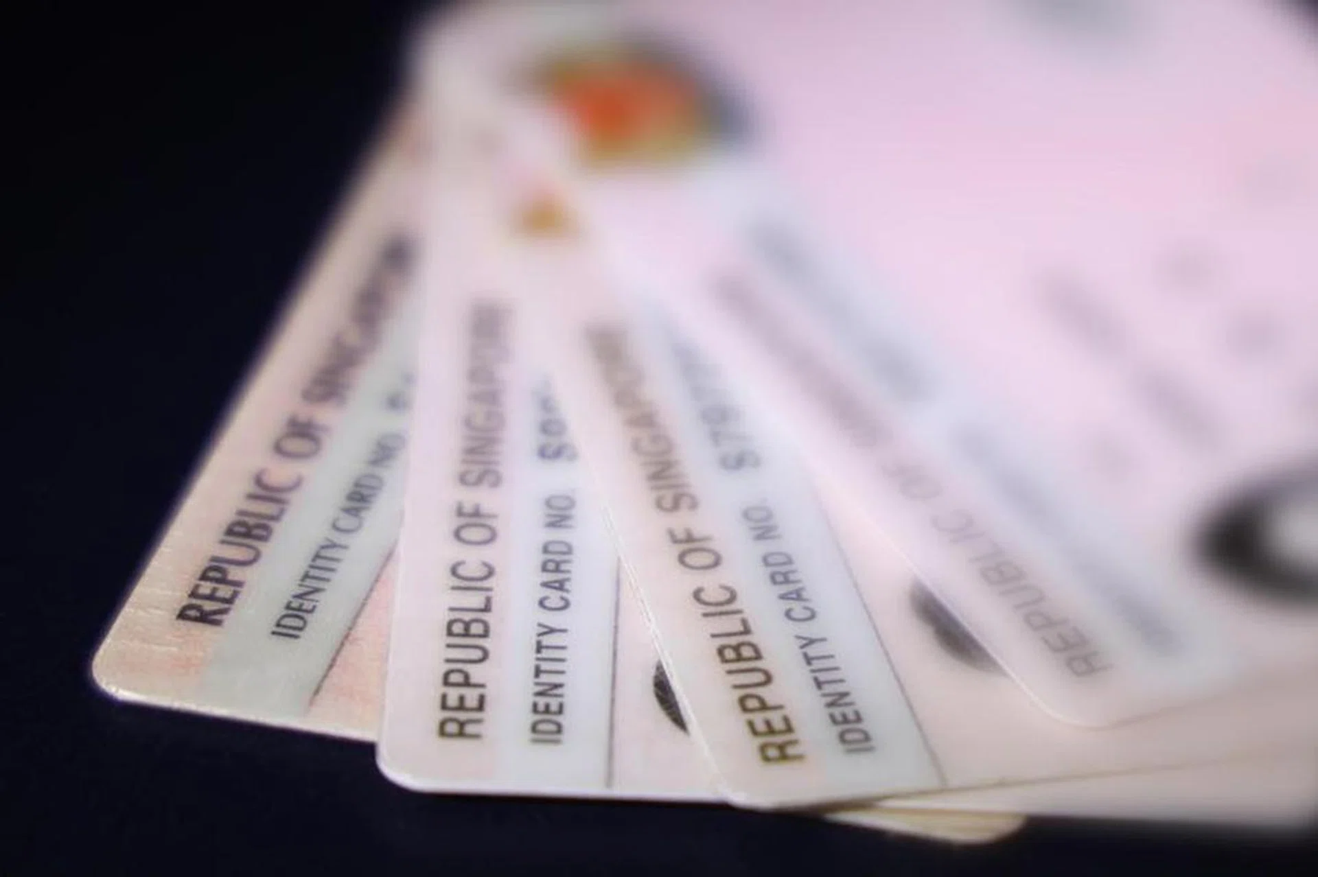 Experts said the risks highlight how an NRIC number in the wrong hands can pose risks to individuals, who need to be vigilant against scams. Photo: Lianhe Zaobao.