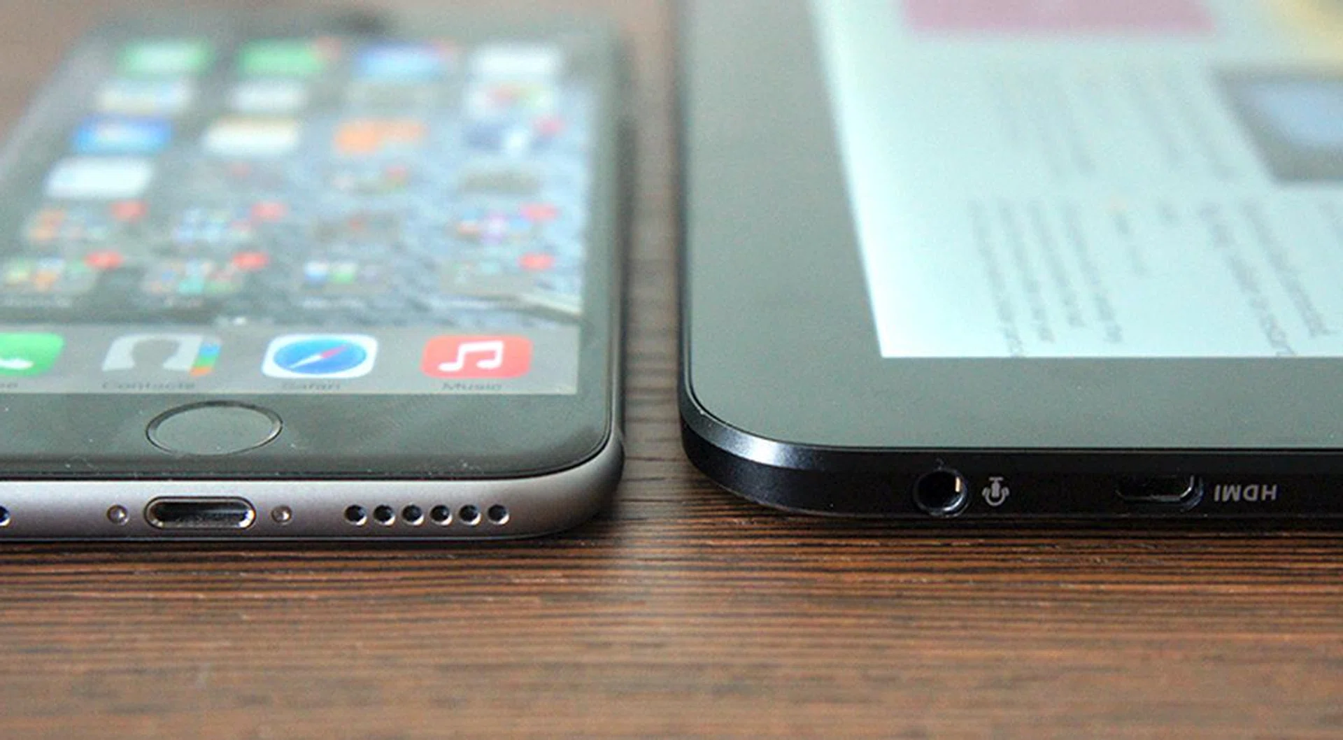 Here is the ASUS Transformer Book T300 Chi next to an iPhone 6. There's really not much difference between the two.