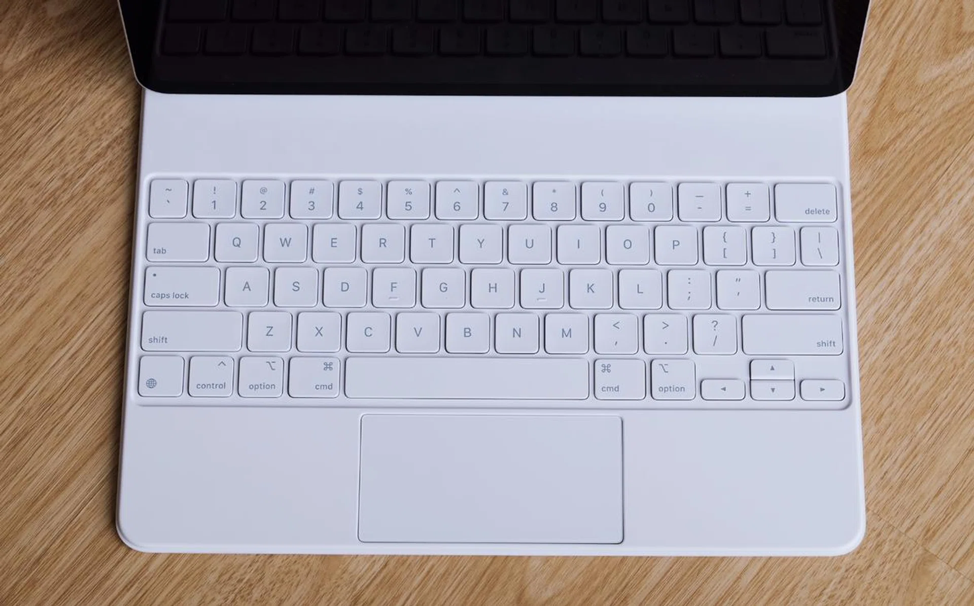 The white Magic Keyboard goes well with the silver iPad Pro.