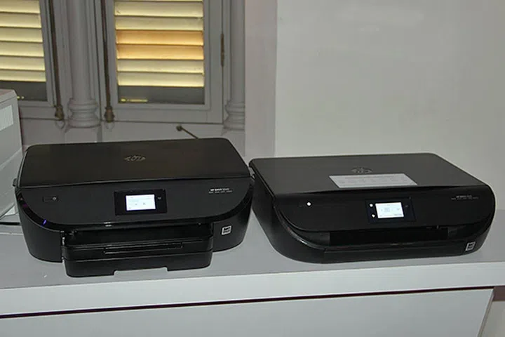 The HP Envy 5540 (left) is slightly bigger than the Envy 4520 (right), but it prints slightly faster too.