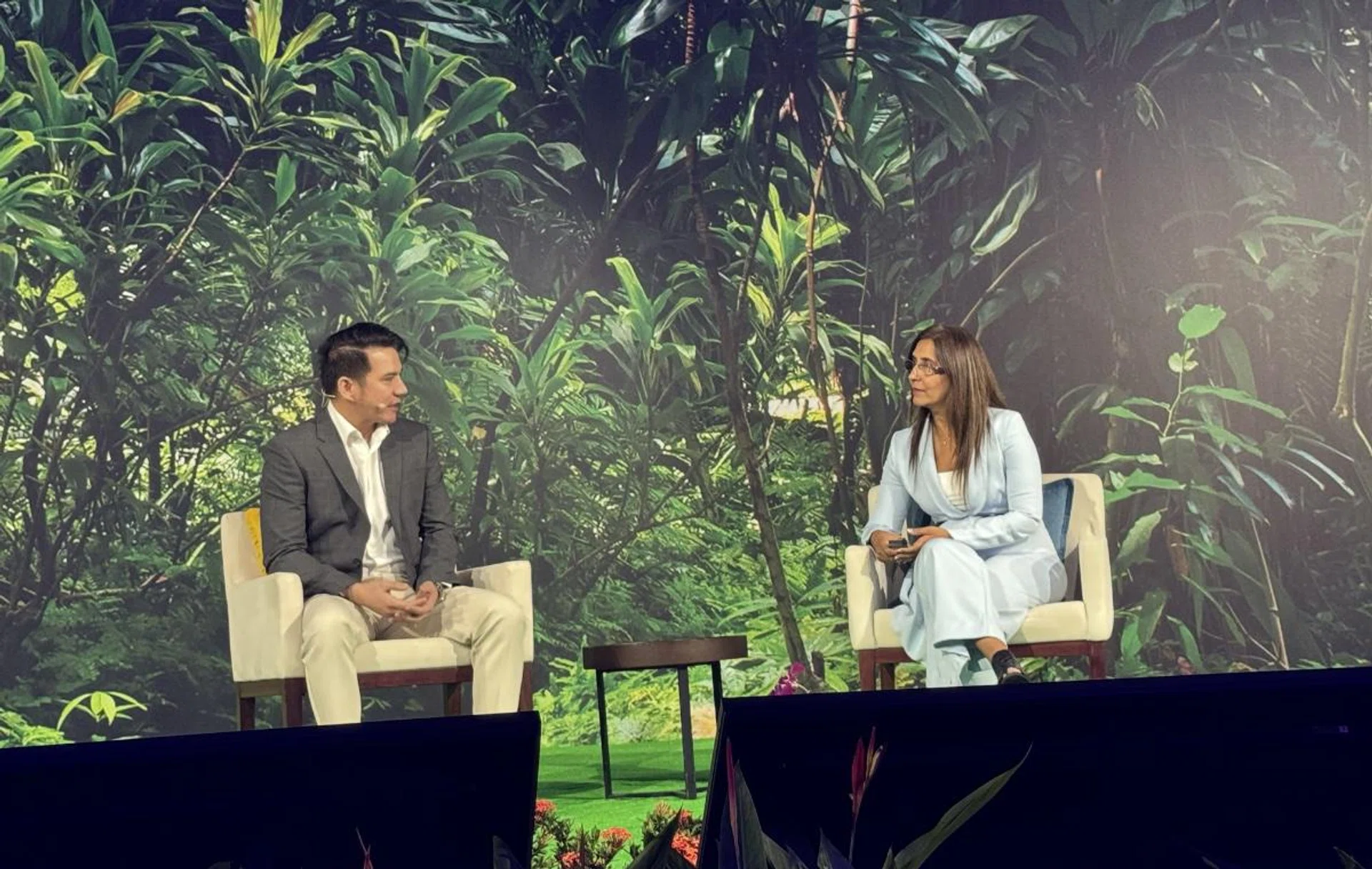 Mac Munsayac, Head of Customer Experience at Philippine Airlines having a fireside chat. 