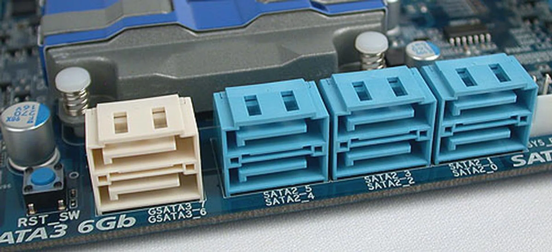 The SATA ports marked in white are of the SATA 6Gbit/s variety. A small reset switch in blue is located besides them.