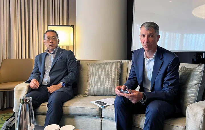 From left:  KC Choi, EVP and Head of Global Mobile B2B, Samsung, seated with Michael Wallent, CVP at Microsoft Security - Management.