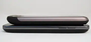 The LG Optimus 2X isn't a hefty monster by a long shot, and is almost equally as thin as the HTC Desire (shown here on top) or the Google Nexus S. Nonetheless, it is definitely thicker than the slim Samsung Galaxy S.