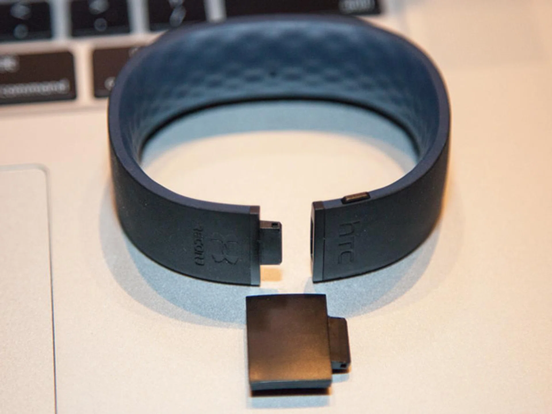 You can attach a link to expand the size of the HTC grip for a better fit.