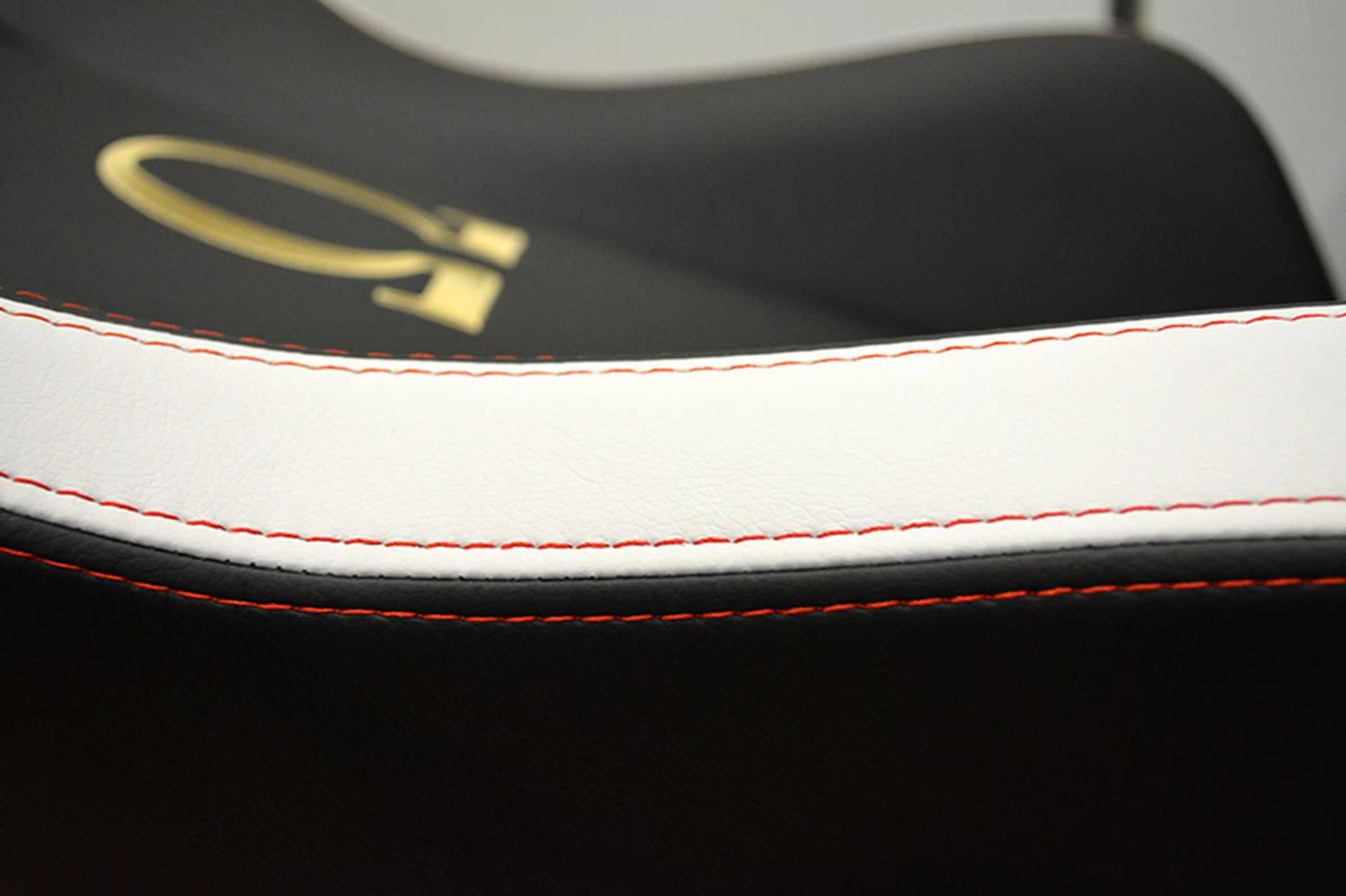 The red stitching goes especially well with the white paneling on the Classic version.