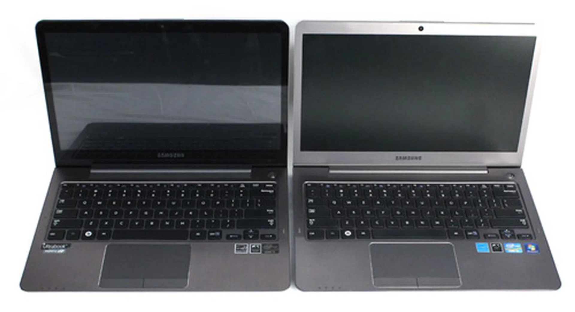 The new Ultra Touch (on the left) is a bit darker, and uses an edge-to-edge glossy touchscreen panel, compared to the matte display found on the original Series 5 Ultra (on the right).