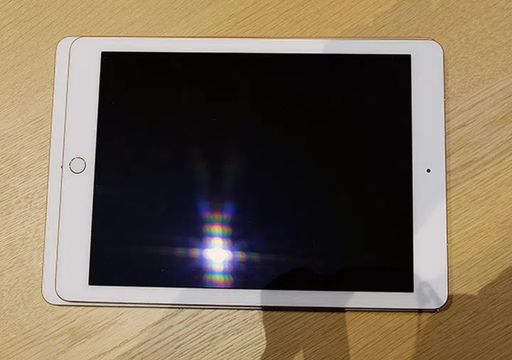 The 9.7-inch model is on top of the 10.5-inch model. See how it is only a tad larger?