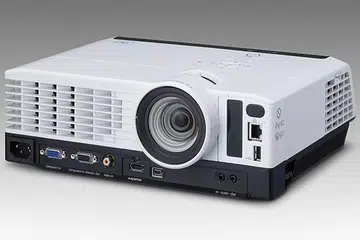 The Ricoh PJ WX3340N is a DLP-based, WXGA projector with a 'desk edge' design, where its interfaces and vents are placed right in front. (Image source: Ricoh.)