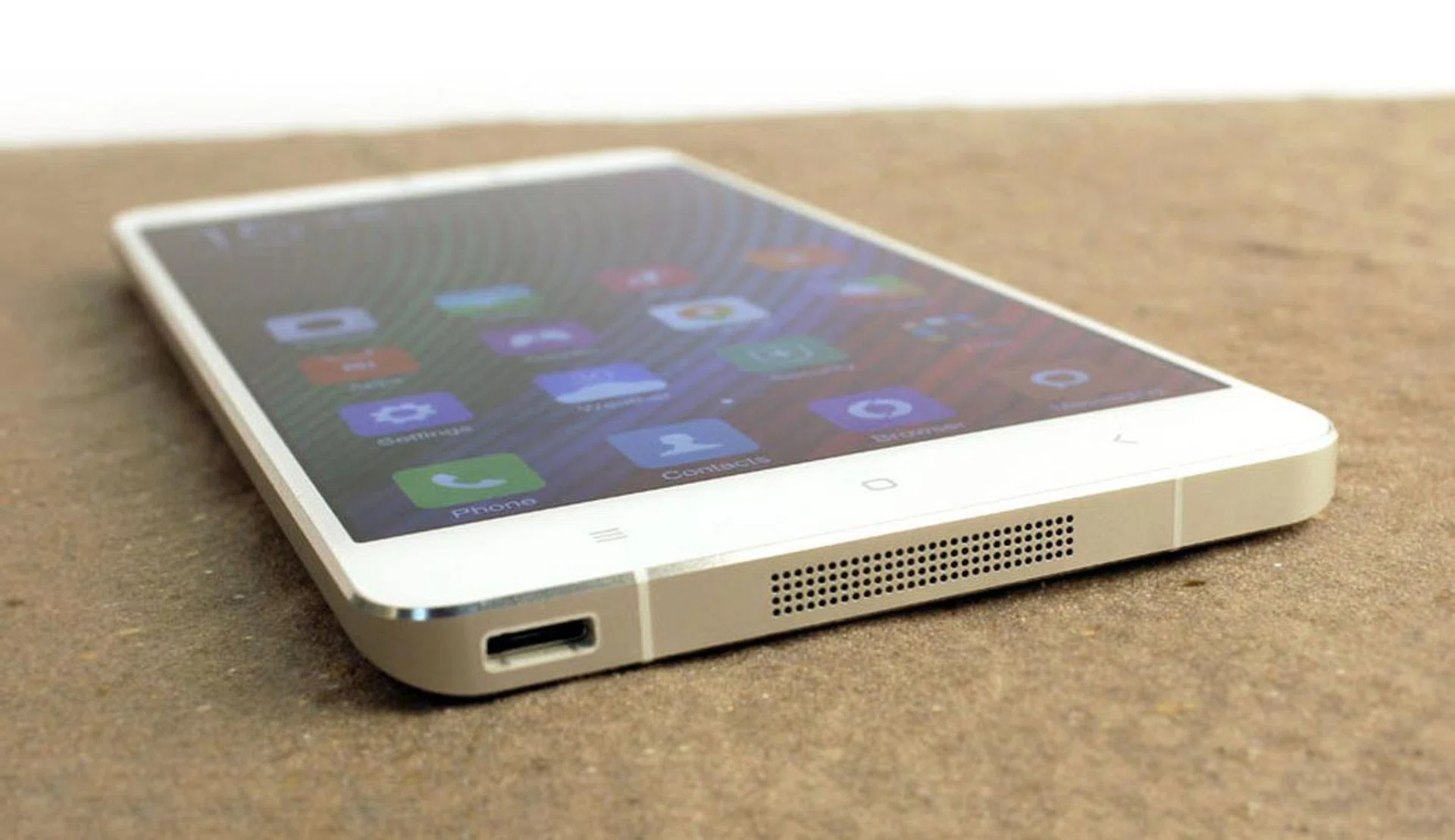 The micro-USB port and speaker grille can be found at the bottom of the device.