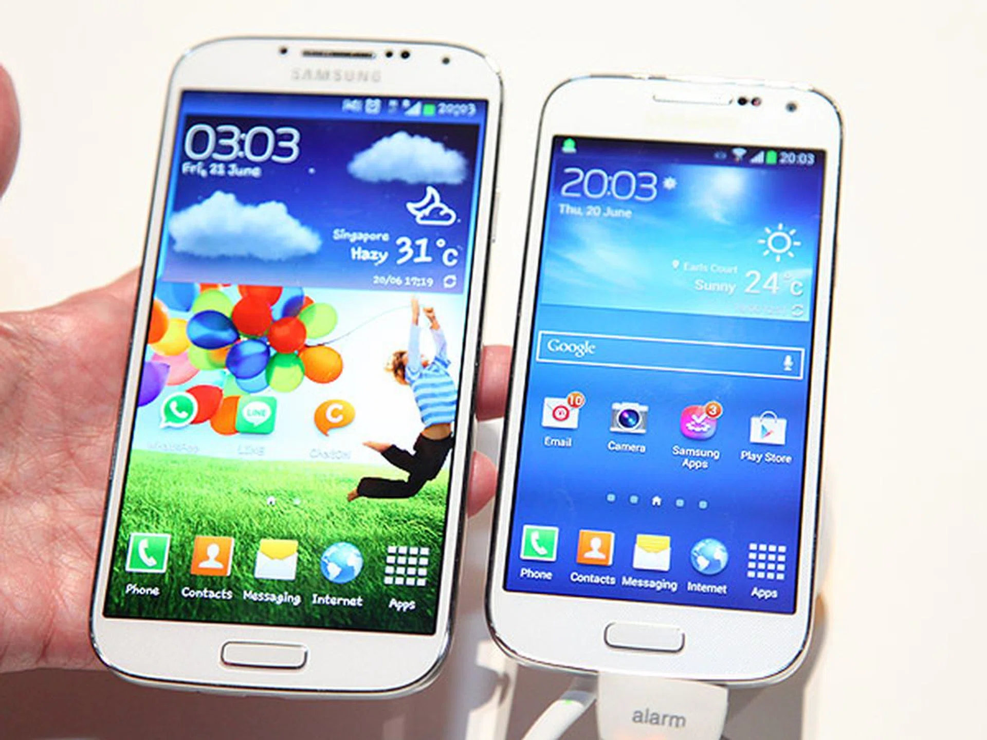 The Samsung Galaxy S4 (left) compared with the Galaxy S4 mini (on the right).