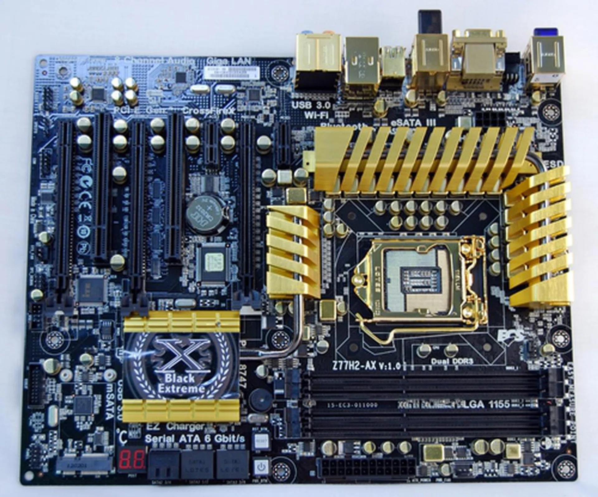 The ECS Z77H2-AX is an opulent looking board with gilded components set against a black PCB. Even its VRM heatsinks are gold-plated as well as its capacitors and chokes. Its CPU socket metal frame and the CPU back panel have also been given the gold colored treatment.