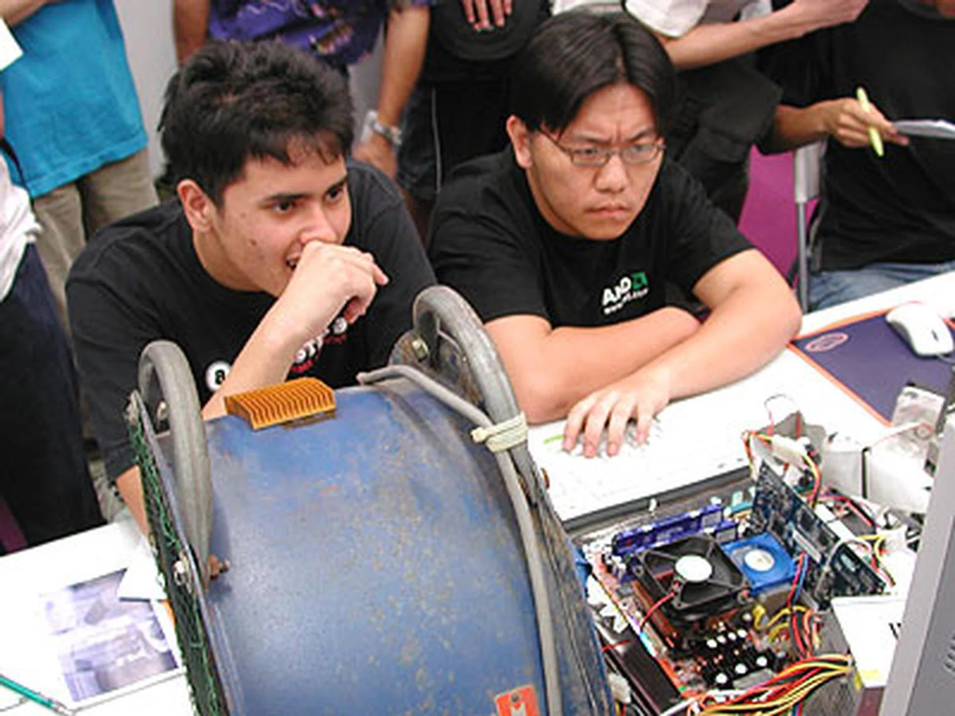 Rundymc (left) and Krado (right) were seen tweaking the system minutes before the competition began.