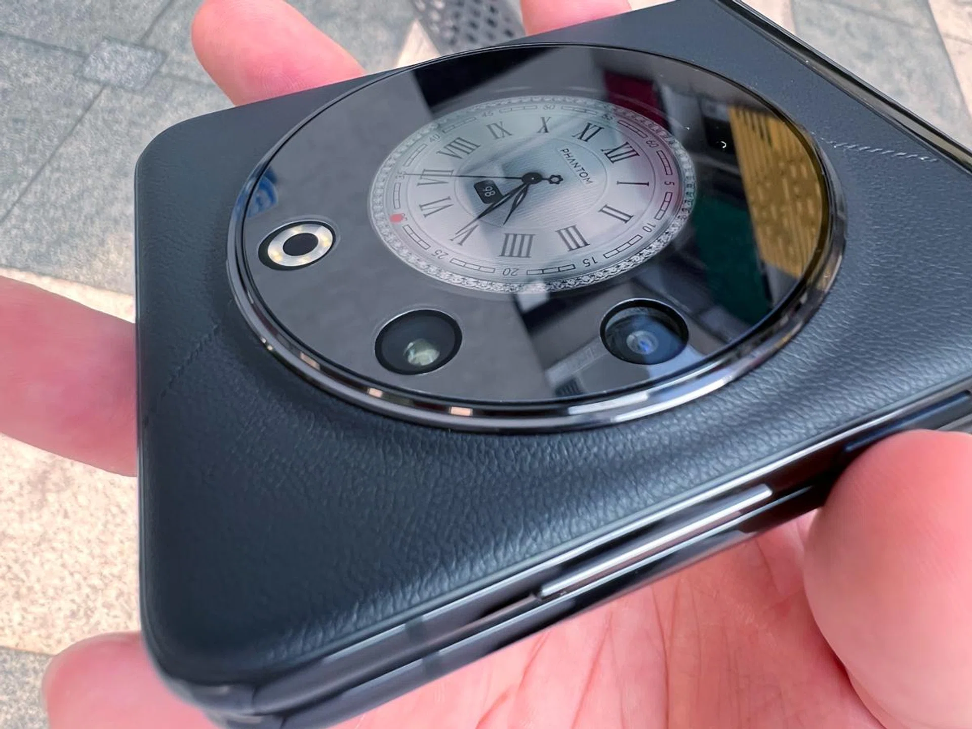 The Tecno Phantom V Flip 5G offers a 64MP main, 13MP ultra-wide, next to its flash module.