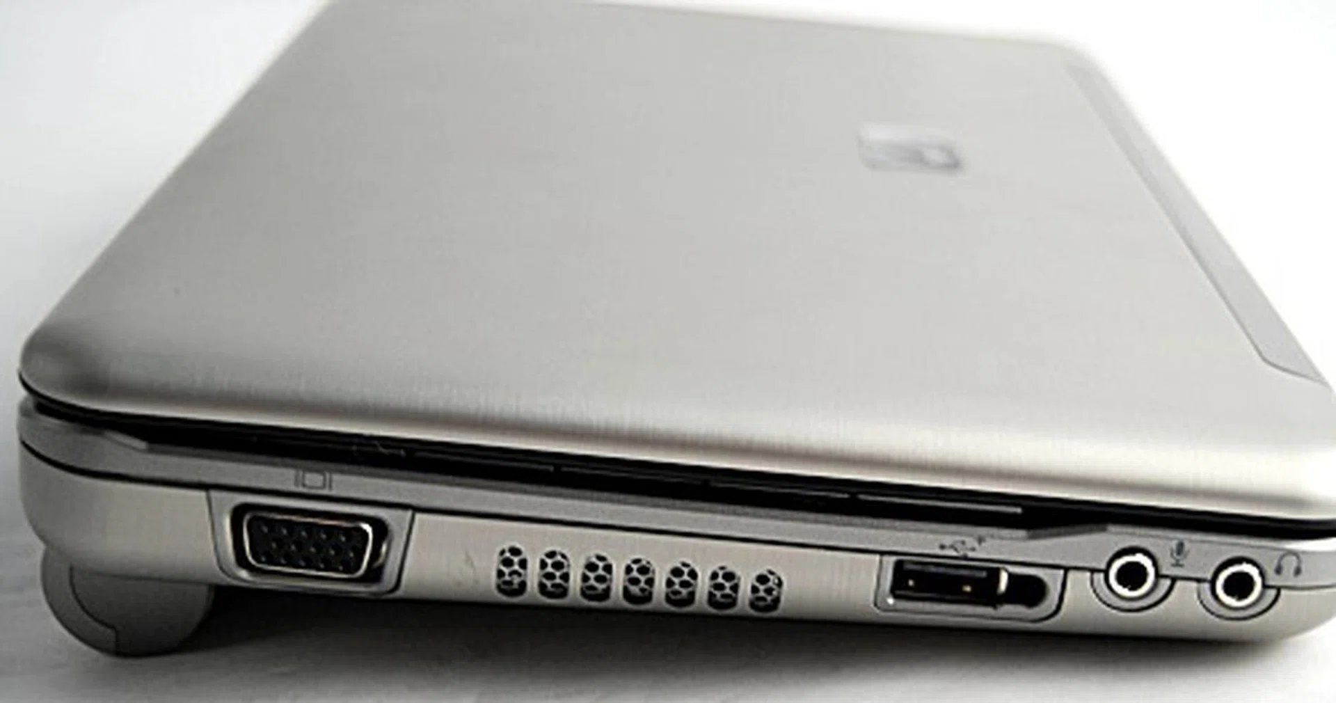 The left side profile of the Mini-Note sports a video analog out, a powered USB port for a removable optical disk drive and the standard microphone and headphone jacks.