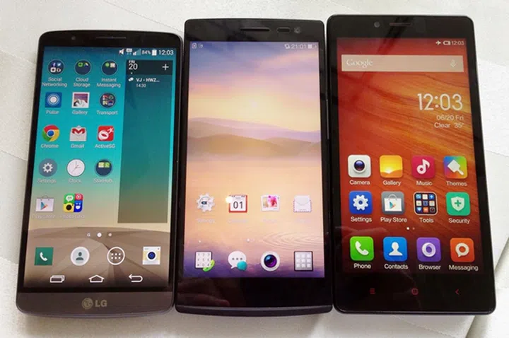 Seen here are the LG G3 (left), Oppo Find 7 (center) and Xiaomi Redmi Note (right). Both the G3 and Find 7 sport slimmer bezels, hence they occupy a smaller footprint.
The Oppo Find 7 in this photo is courtesy of our friends from CNET.