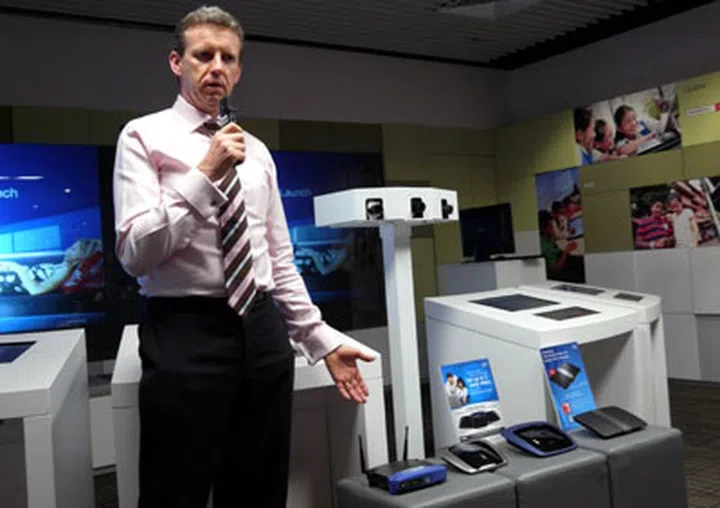 Mr Craig Gledhill, Vice President of CISCO Consumer Products Asia Pacific, is a huge advocate of the new-fangled NGNBN being rolled out nationwide. He's shown here trying to draw wireless power from Linksys' legacy and fresh routers. Just kidding on the last bit!