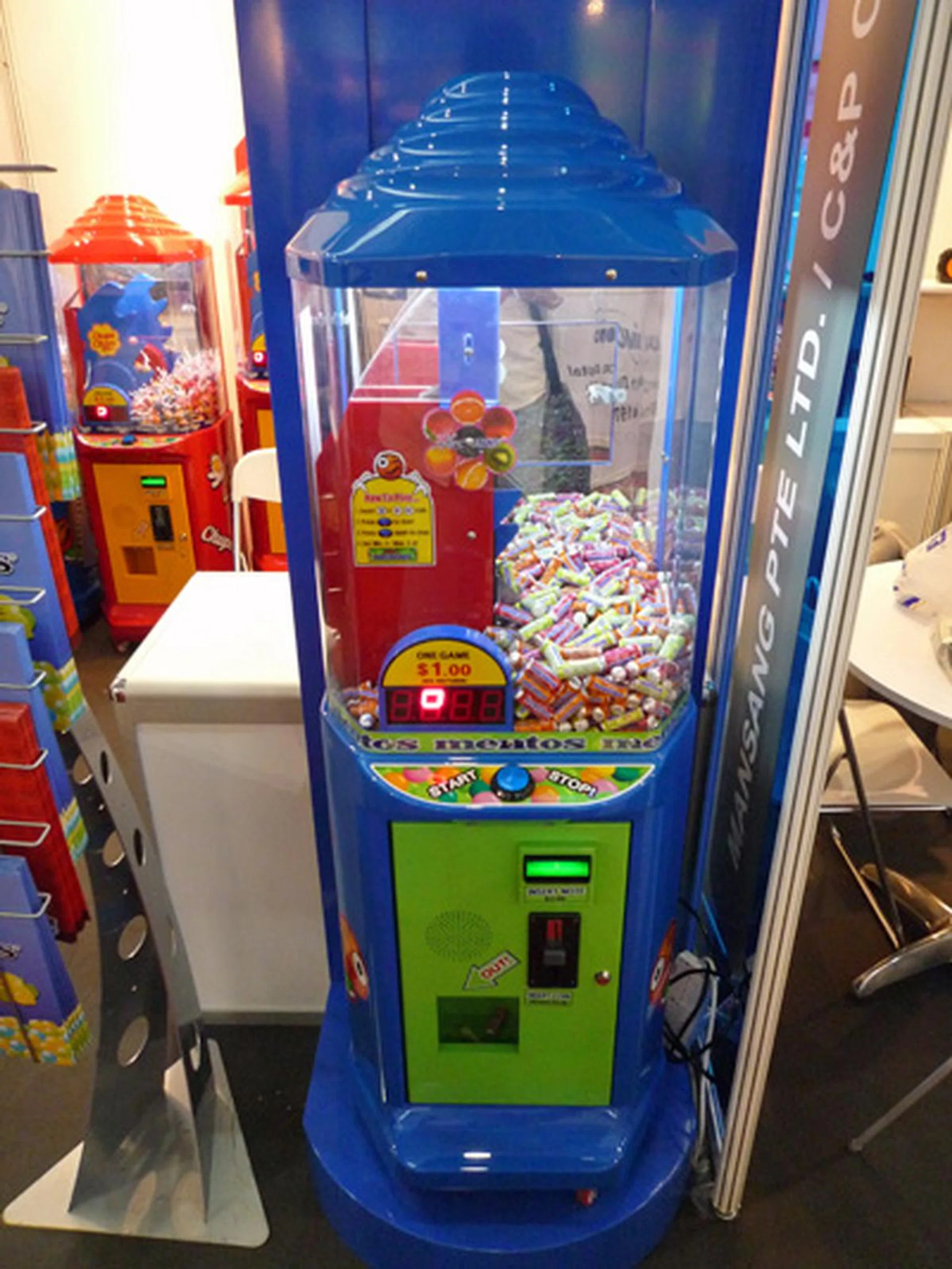  There was an interesting booth at CommunicAsia that promoted a Chupa Chups/ Mentos game machine. It was a little out of place in this trade fair but a welcome and refreshing sight.  