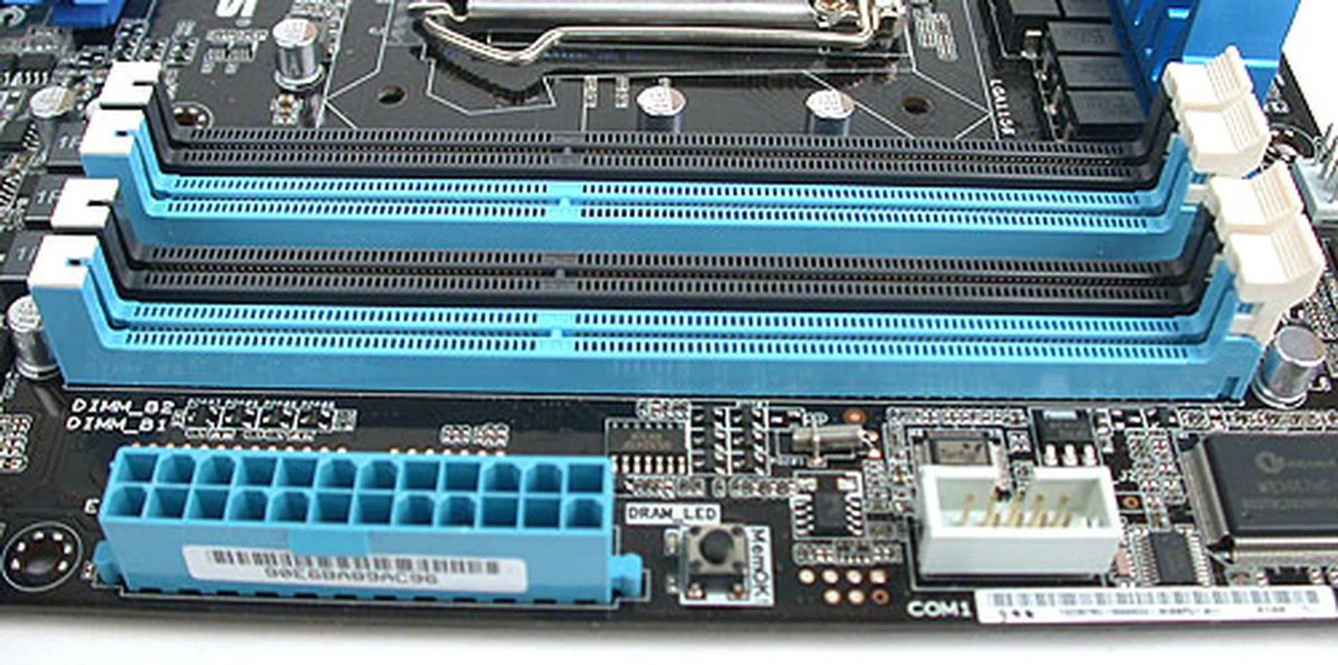 The unique DIMM slots of ASUS' recent motherboard designs and the 24-pin power connector.