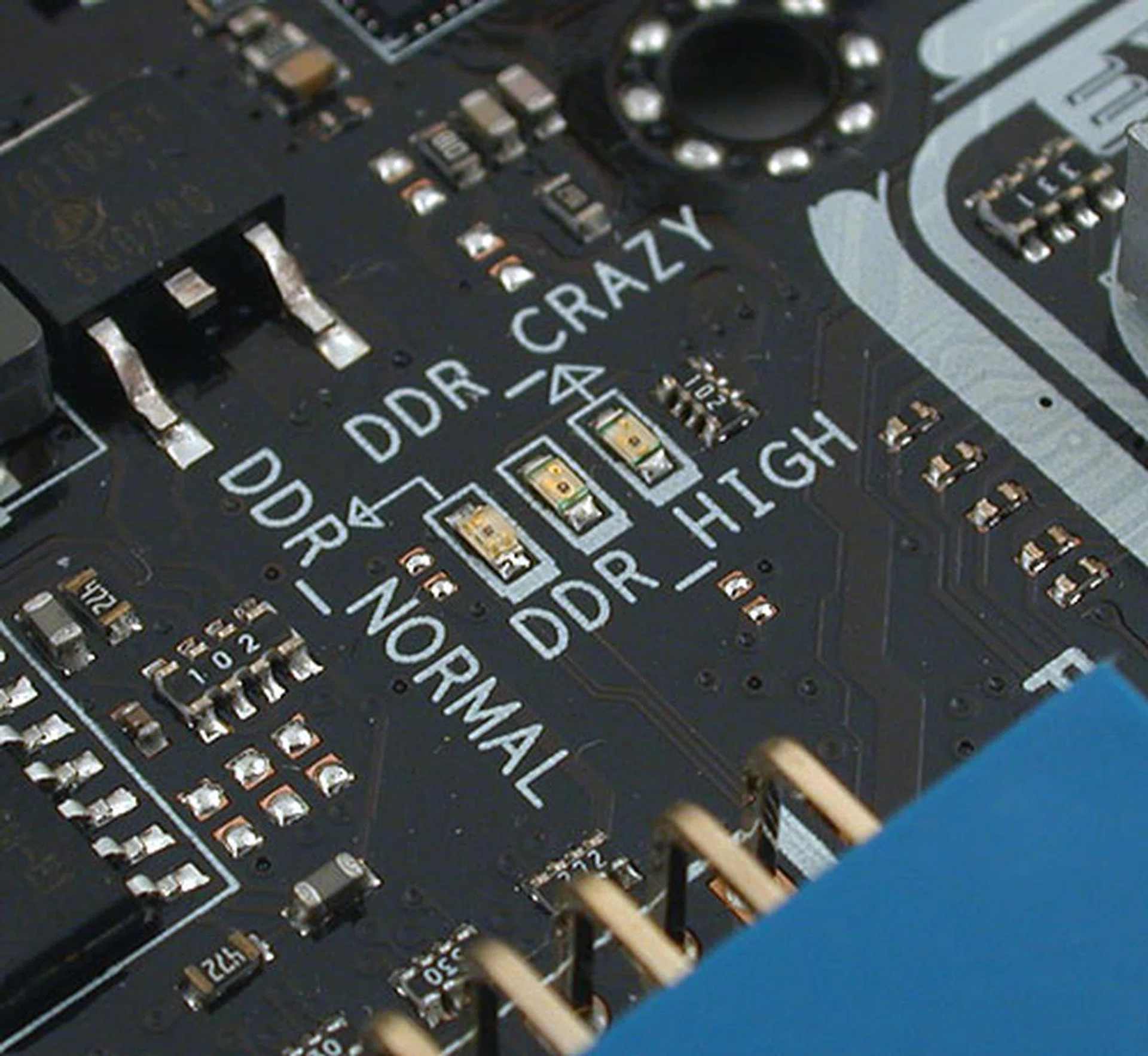 These LEDs help enthusiasts tell at a glance what their memory are running at, especially since these are color-coded, with red being too dangerous for their own good. Yellow and green are the other colors. Similar LEDs are present for the Northbridge (NB) and Southbridge (SB) voltages. 