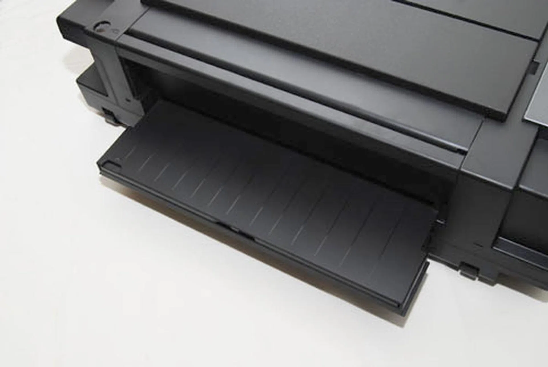 To print A3, you have to open up the back cover. This lets the paper slide all the way back and keeps it flat while printing.