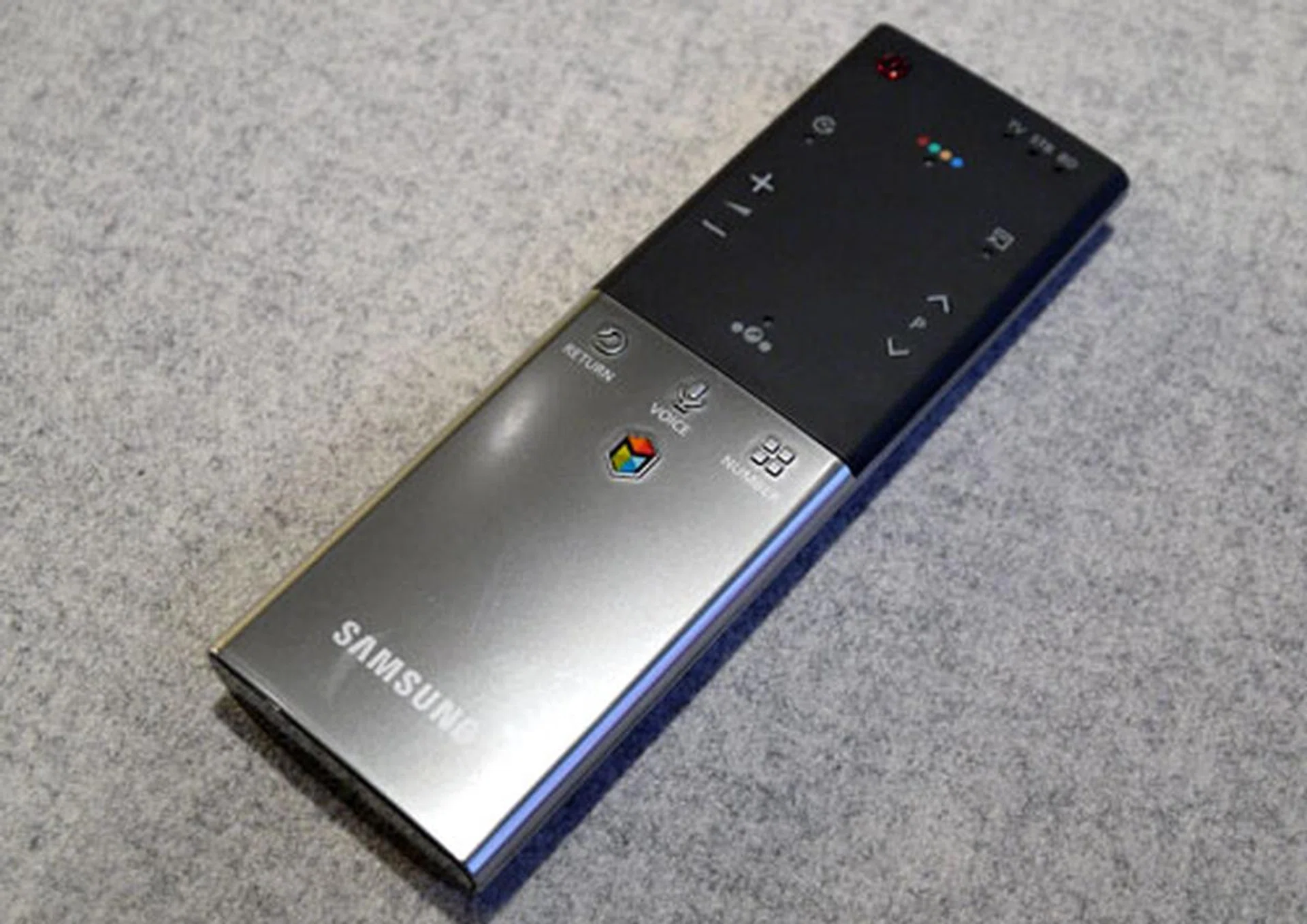 The Smart Touch Remote is a slick piece of engineering. Besides its polished good looks, the remote also sports a Voice button to activate its built-in microphone and a touchpad.