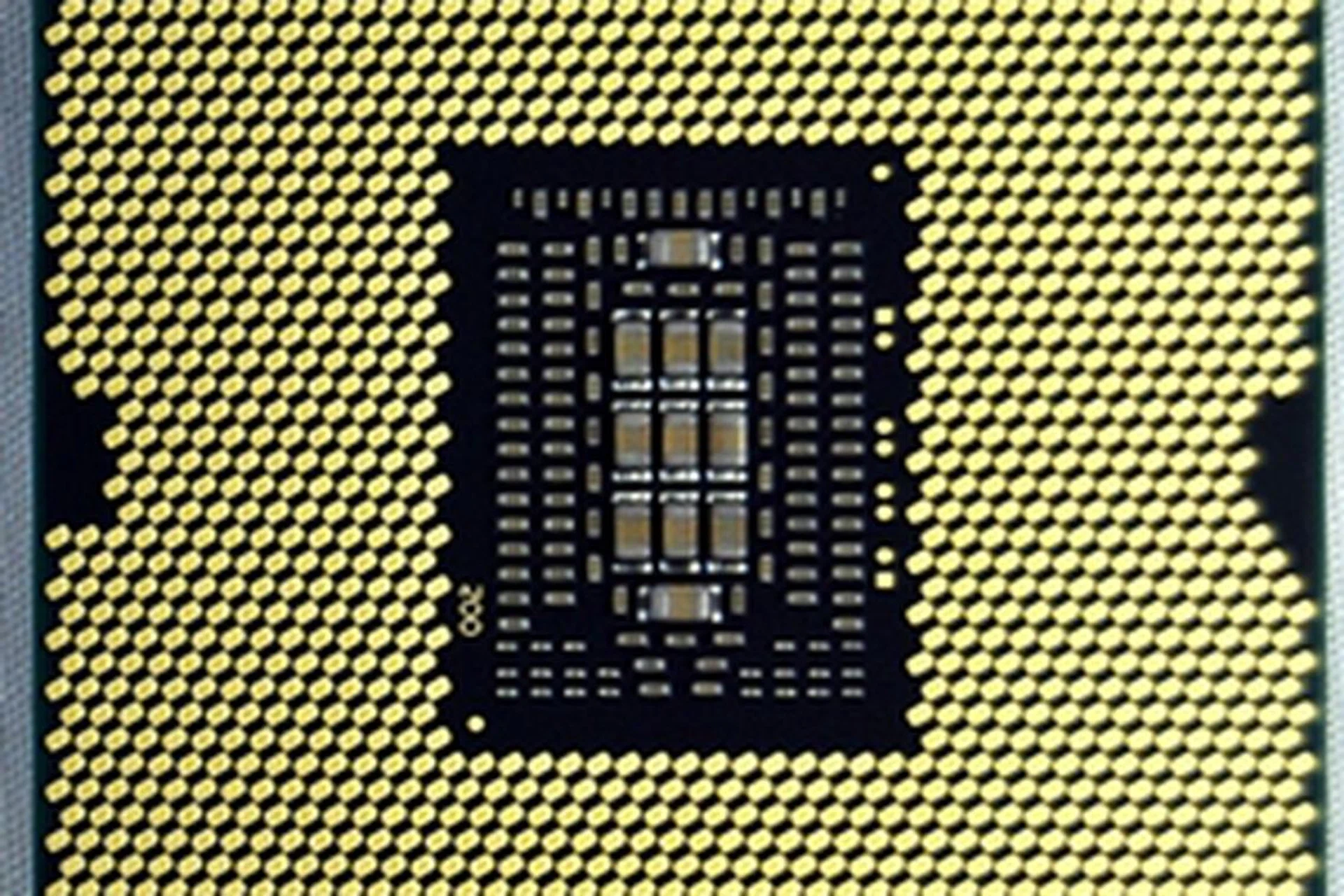 Pictured here is the Intel Core i7-3960X CPU, with its contact pads, that is compatible with a LGA2011 CPU socket. The Intel Core i7-3970X processor will come in the same package.