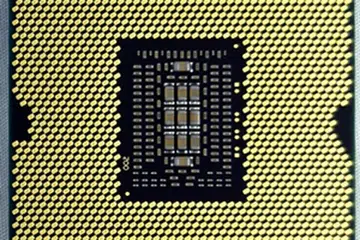 Pictured here is the Intel Core i7-3960X CPU, with its contact pads, that is compatible with a LGA2011 CPU socket. The Intel Core i7-3970X processor will come in the same package.