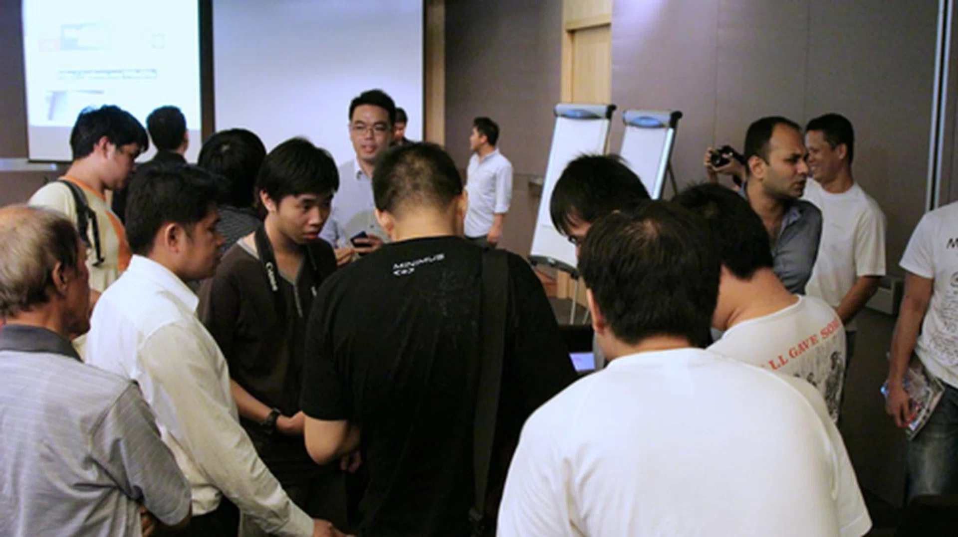 Excited attendees flocked around Microsoft representatives, Victor (in glasses facing the camera) and Nazeem (grey button down shirt, also facing the camera), who were not just showing off Microsoft's Windows Phone 8 software, but also hardware from Nokia and HTC.