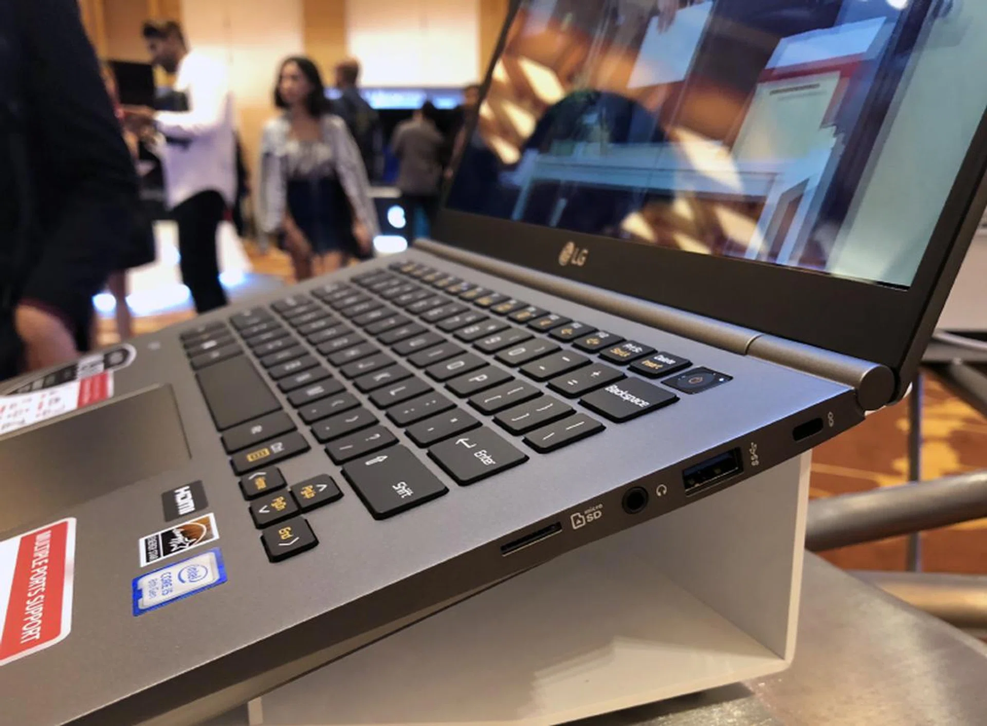 On the right, there's another USB 3.0 port, a headphone jack, a micro-SD card reader, and a Kensington lock slot.