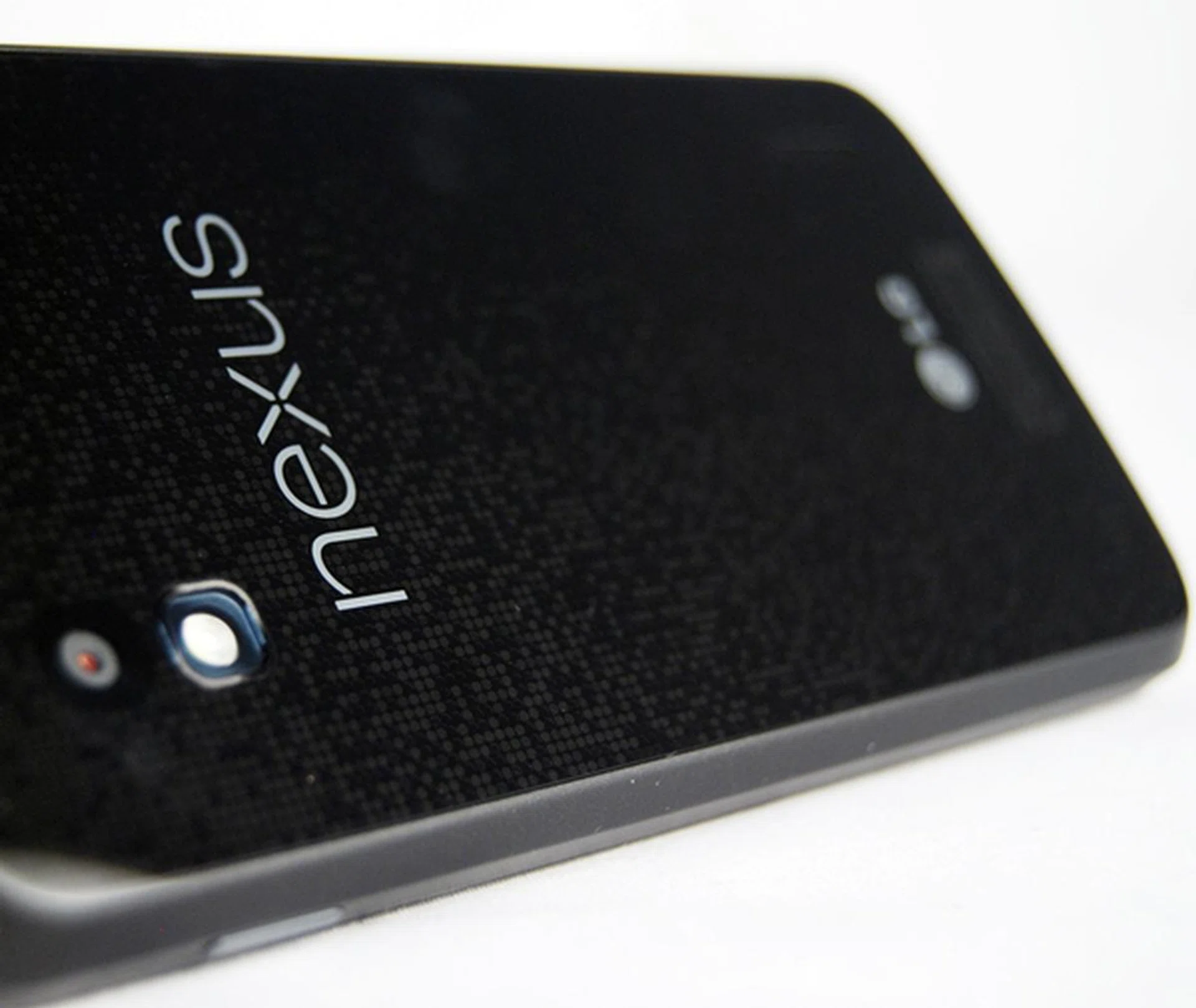 The back of the LG Nexus 4 stands out with its unique reflective pattern of tiny circles which reflect light at certain angles.