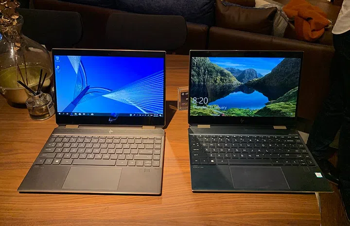 The Spectre x360 13 in Dark Ash Silver (left) and Poseidon Blue.