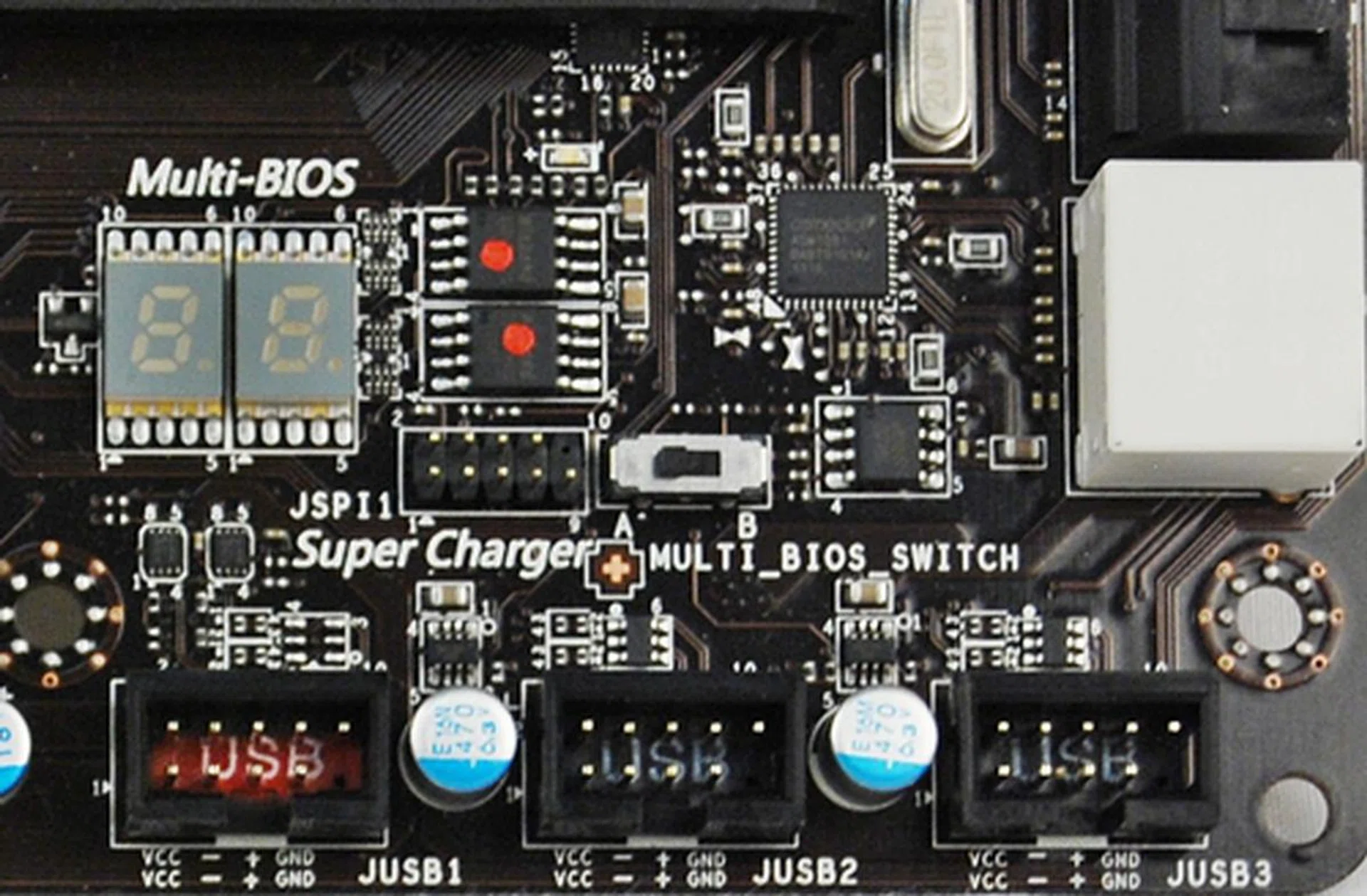 There is a Multi-BIOS switch located behind the second set of white SATA 6Gbps connectors. With the board in vertical orientation, flicking the switch left will toggle BIOS ROM A while BIOS ROM B is toggled when the switch is shifted right,