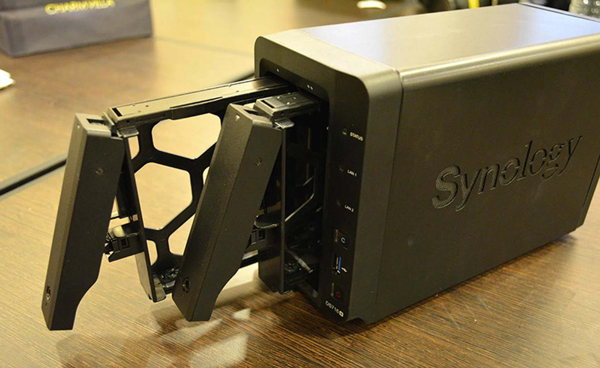 The two drive bays on the DS716+ pop open via a click mechanism, allowing for easy installation or swapping of drives.