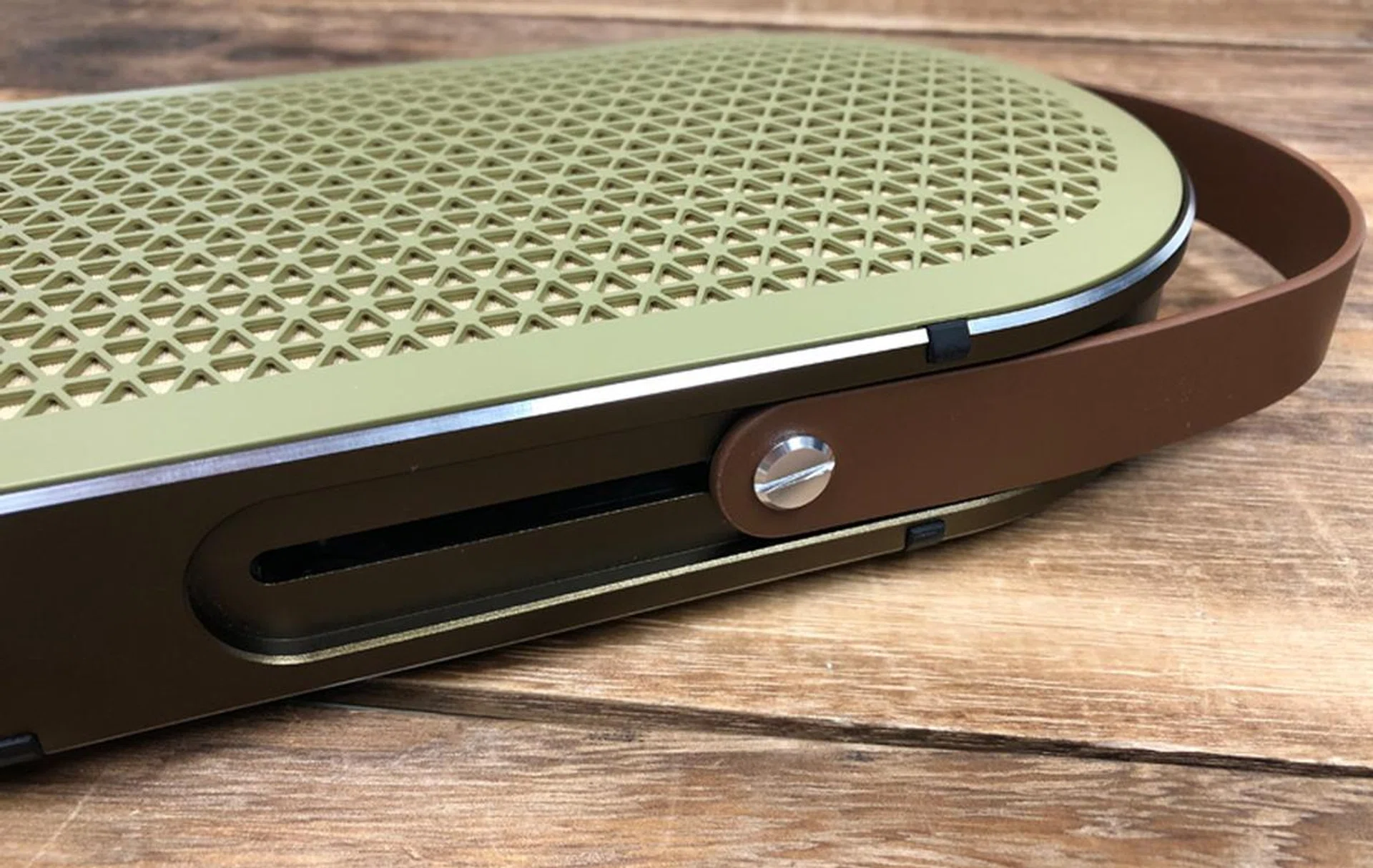 The leather strap extends out for easy carrying.