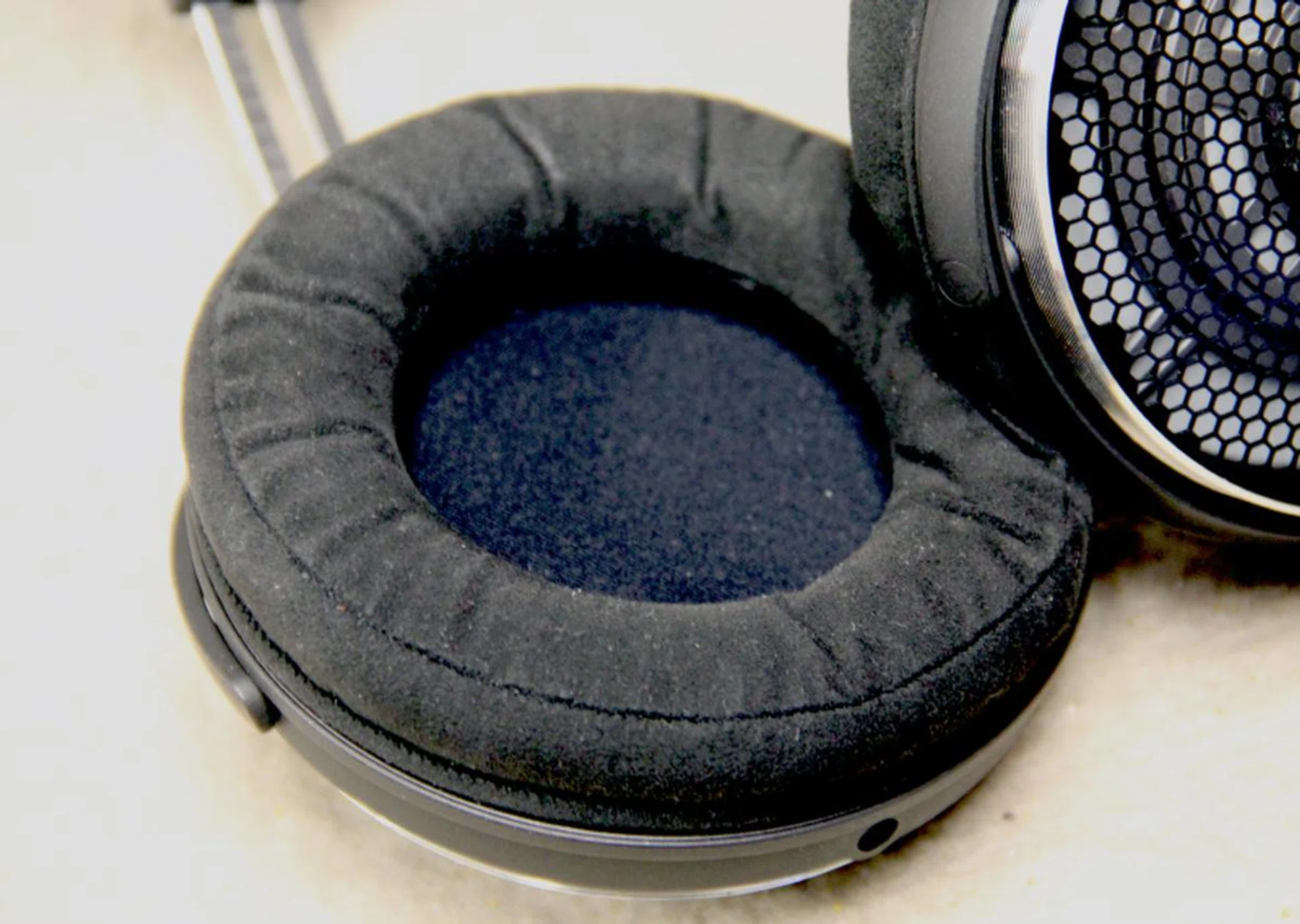 Though the Alcantara earpads are soft, they are shallow.