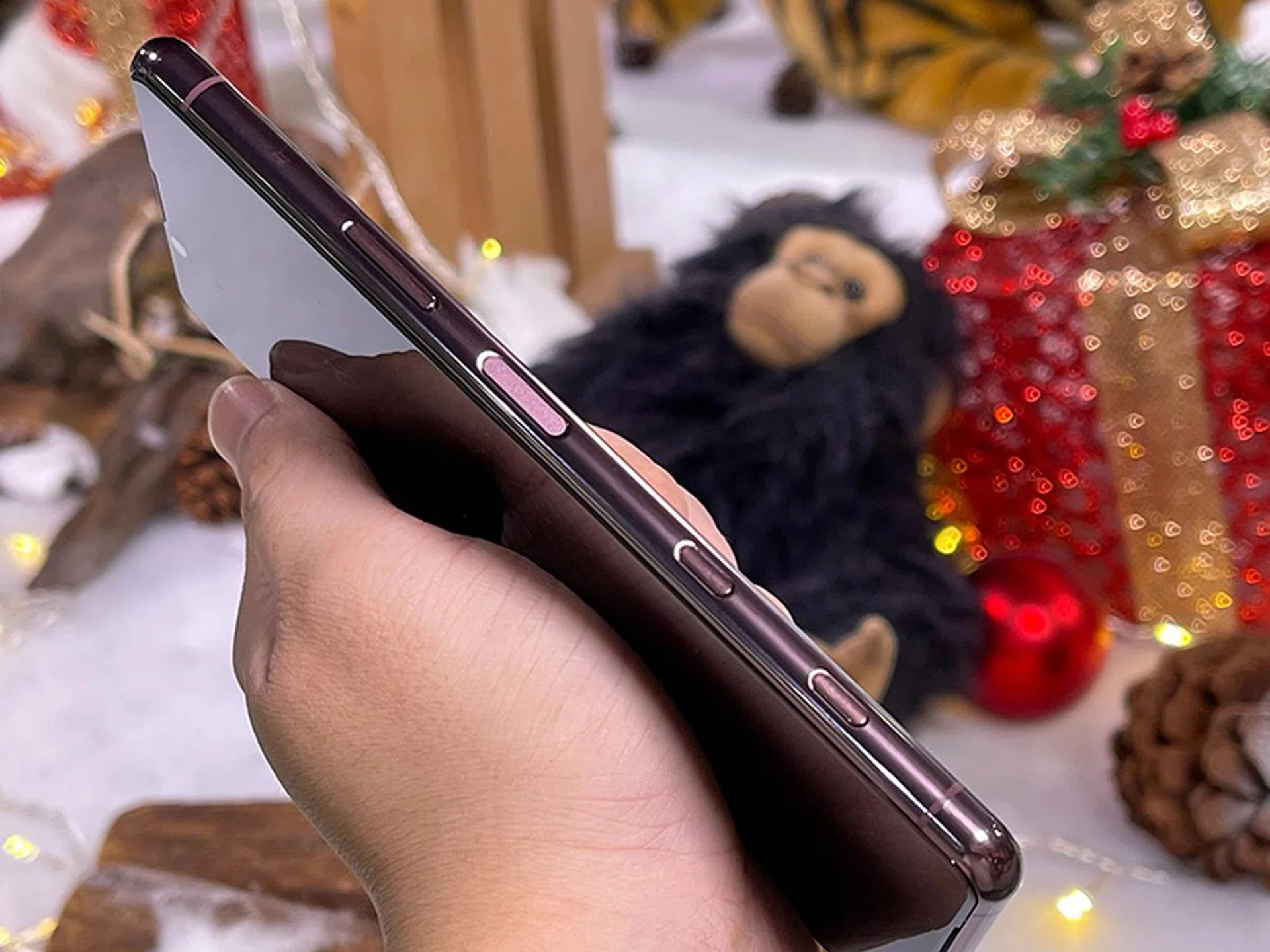 From top to bottom: volume rocker, power/lock button, Google Assistant button (which doesn't work), and a physical shutter and shortcut key for camera.