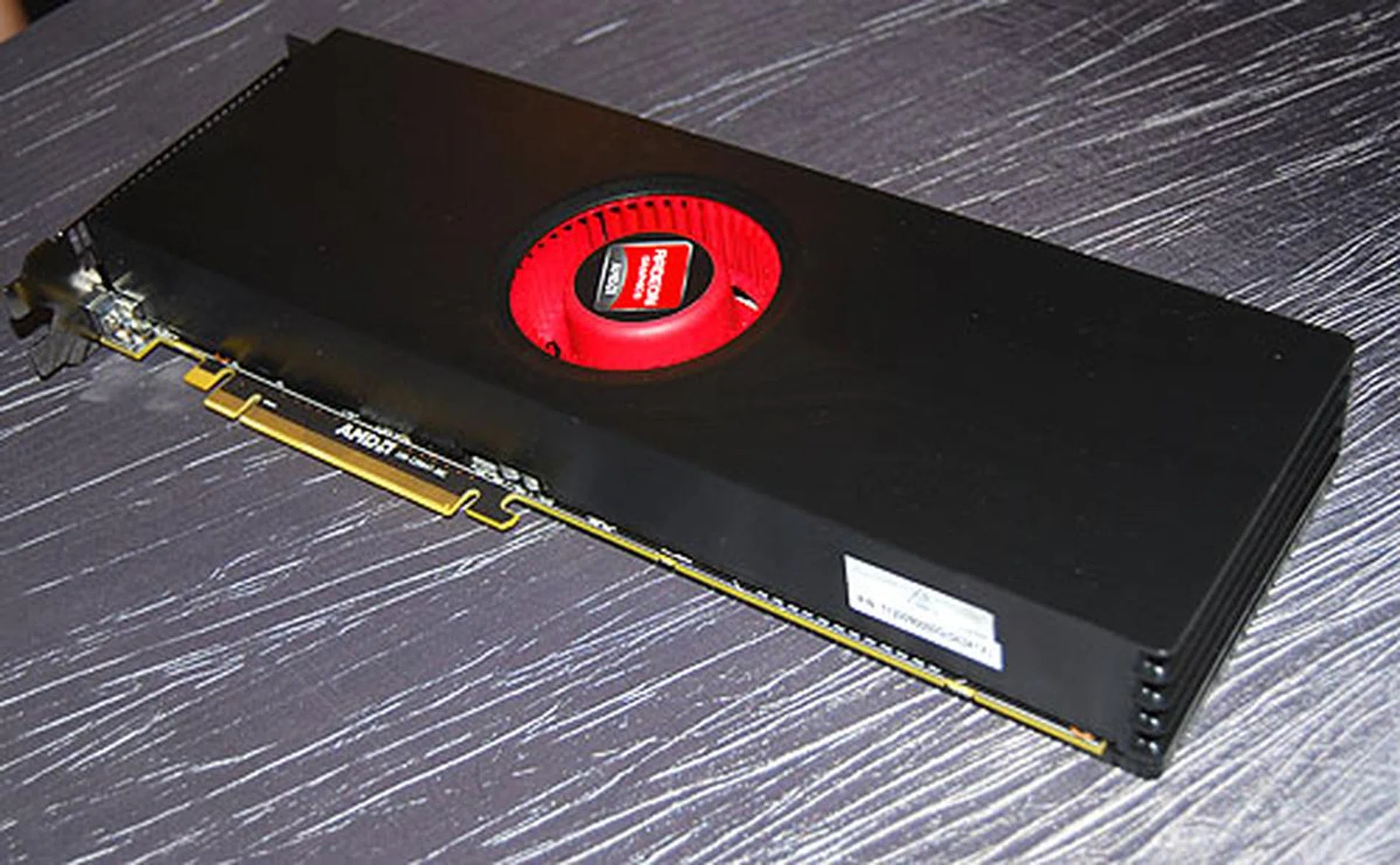 It's really long....we don't exactly have a ruler or anything else to compare, but let's just say it's close to the length of a forearm. The single blower fan looks tiny in comparison.