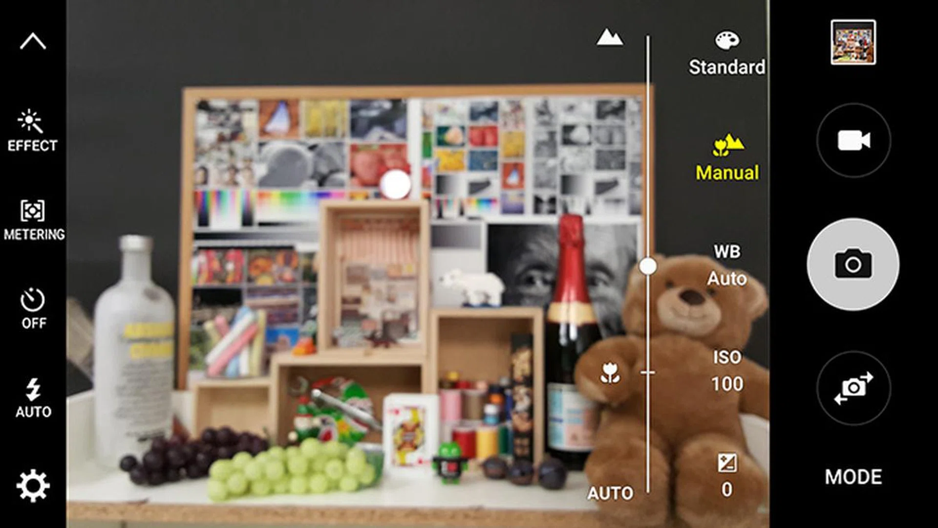 Manual focus is achieved by way of the slider. 