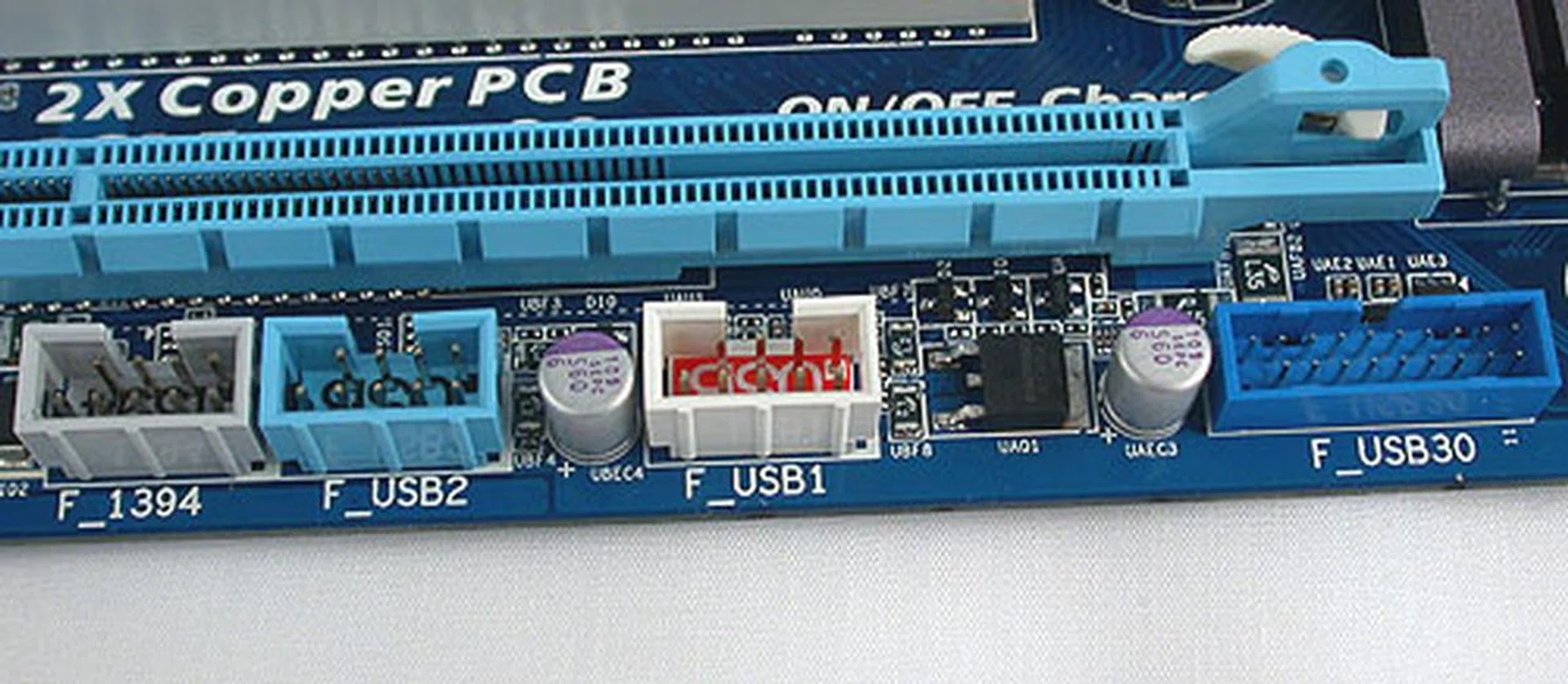 FireWire, USB 2.0 headers and even an USB 3.0 header can be found at the edge of this board. 