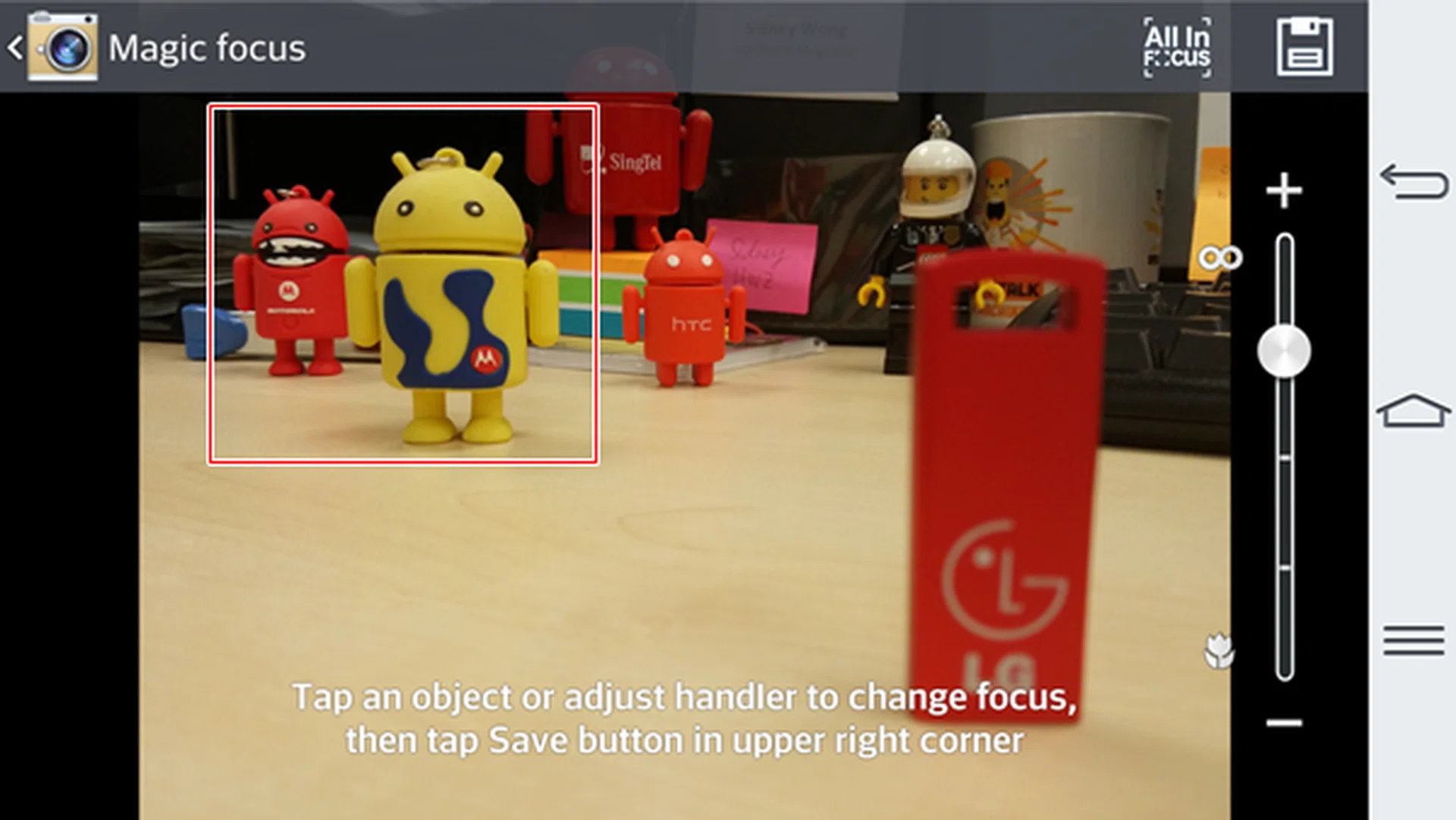 The objects highlighted in the box appear more in focus after we tapped on the red android toy.