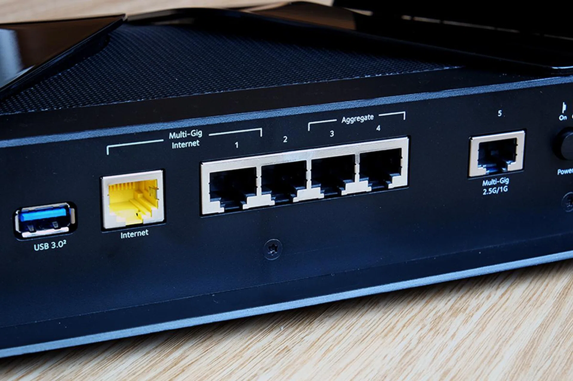 The Netgear Nighthawk RAX200 supports port aggregation for both WAN and LAN ports. Pity it only has four LAN ports.
