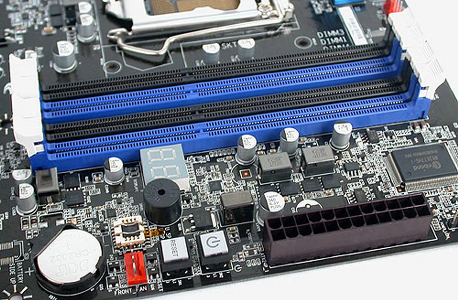 The DDR3 memory support officially goes up to 1600MHz on this Intel board, with a maximum of 32GB of memory. As you can see, there are power and reset buttons, along with a debugging LED.