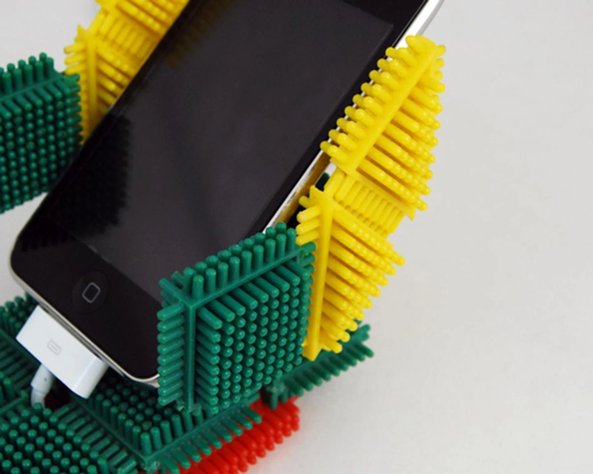 The sides will have to be included to prevent the iPhone from sliding out.