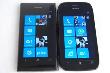In comparison, the Lumia 800 (left) and its angular edges don't feel as comfortable as the curved design taken by the Lumia 710 (right).
