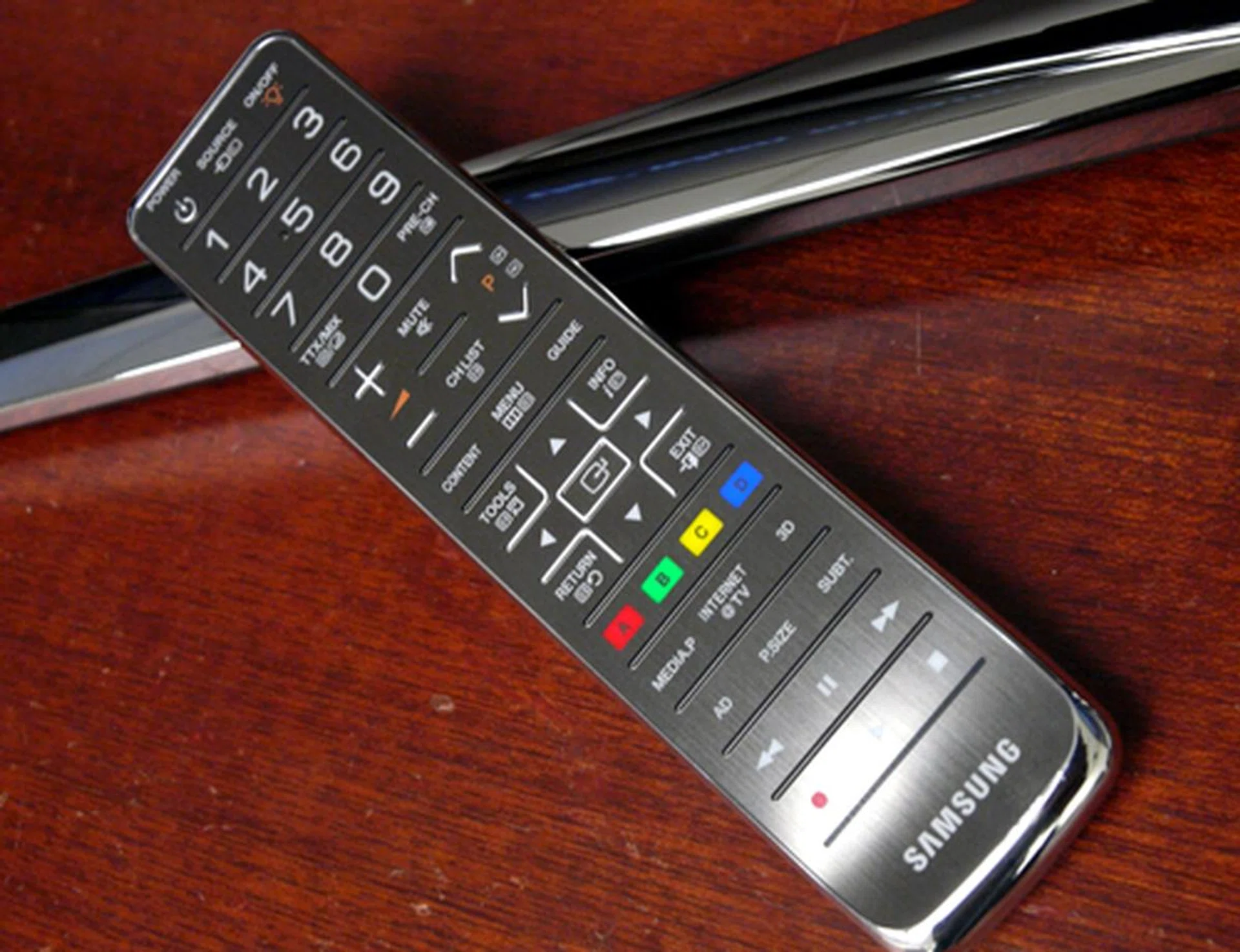 You seldom find a remote which is aesthetically pleasant, but it appears Samsung has outdone themselves with this swanky brushed-metal stick. Best of all, it comes with LED backlights too, just like the TV it was built for.