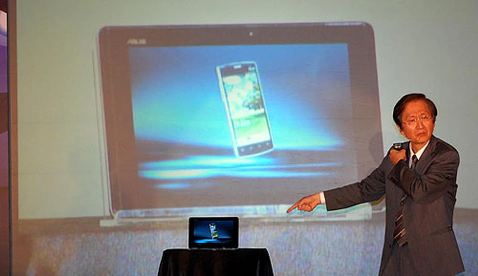 ASUS' chairman did his best magician impersonation, waving his hands as he revealed the not-so-secret Padfone.