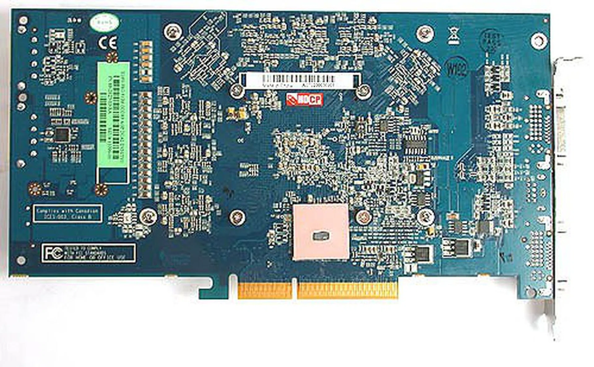 As seen on the rear side of the card, Sapphire's PCB layout and signal routing choices have shifted the location of the Rialto chip higher than its competitors. This in turn shifted the placement of the GPU and memory modules upwards linearly, which resulted in the overall larger PCB.